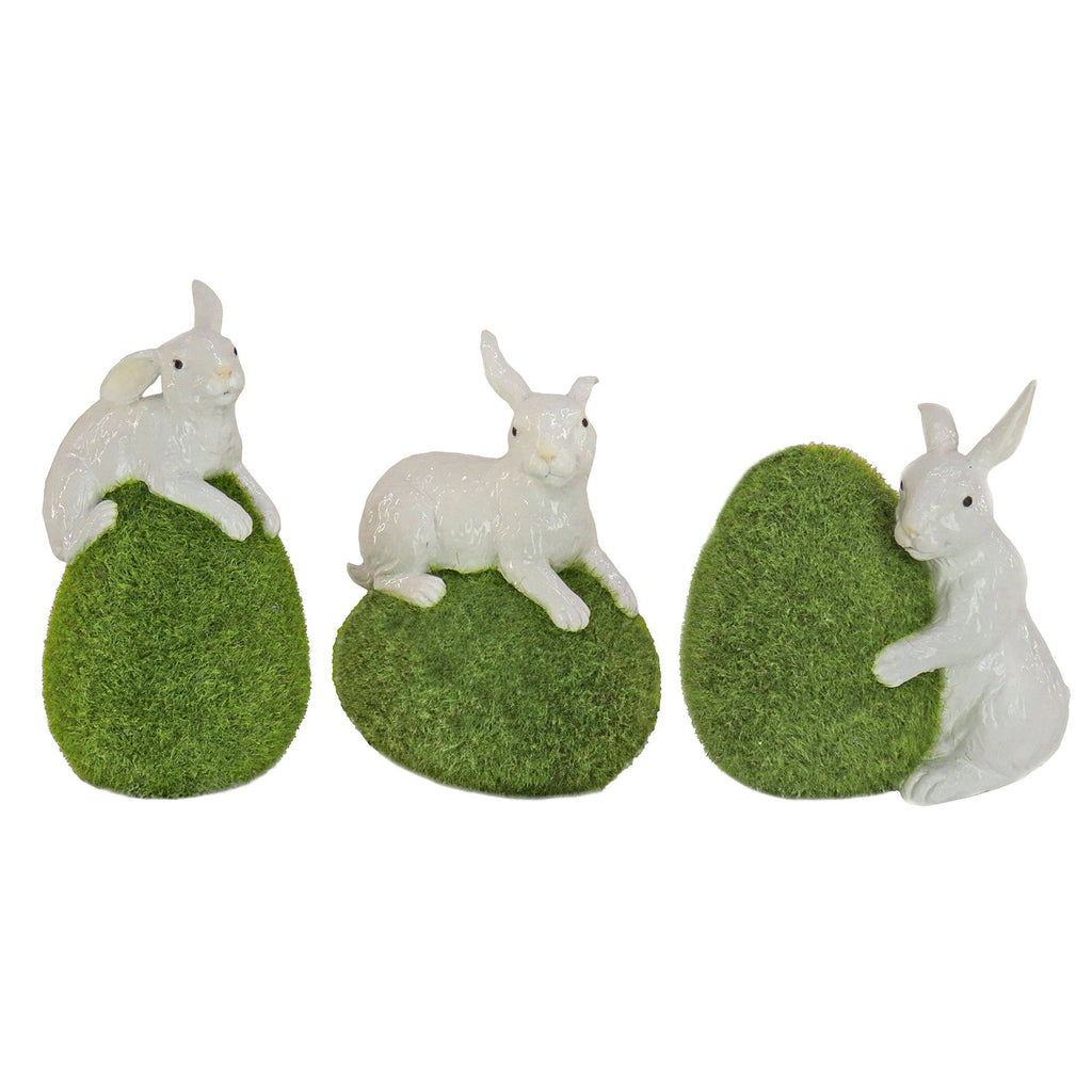 7 in. White Easter Rabbit Figures on Green Moss Covered Eggs, Set of 3